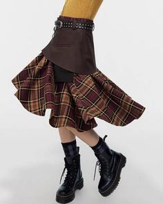 This asymmetrical brown skirt features a structured top section and a plaid bottom, accented with stylish buckles. The mix of materials and unique cut create an eye-catching piece Size:• S: Waist: 70cm/ 27.6 in, Length: 66cm/ 26.0 in• M: Waist: 74cm/ 29.1 in, Length: 68cm/ 26.8 in• L: Waist: 78cm/ 30.7 in, Length: 70cm/ 27.6 in Material: Polyester, Vegan Leather Fall Brown Skirt With Asymmetrical Hem, Brown Asymmetrical Hem Skirt For Fall, Asymmetrical Fitted Brown Skirt, Fall Patchwork Asymmetrical Skirt, Chic Brown Asymmetrical Bottoms, Brown Fitted Bottoms With Asymmetrical Hem, Brown Patchwork Skirt For Fall, Fall Asymmetrical Skirt With Belt Loops, Brown Fitted Asymmetrical Skirt