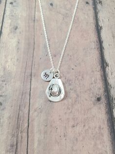 This listing is for a hand-stamped initial necklace featuring a 4/5" x 1/2" zinc alloy cowboy hat charm & 3/10" stainless steel initial pendant. The silver plated chain is 18" long, but can be made to your desired length- see last photo in listing. Please indicate the chain length you would like in the 'notes to seller' section at checkout. All items are lead & nickel free. Message me with any questions, thank you! Add an initial to any necklace https://www.etsy.com/listing/170461597/add-an-init Adjustable Stamped Sterling Silver Charm Necklaces, Adjustable Sterling Silver Stamped Charm Necklace, Western Style Necklaces For Western-themed Events, Personalized Western Silver Jewelry, Personalized Western Style Silver Jewelry, Personalized Silver Western Jewelry, Personalized Adjustable Sterling Silver Initial Necklace, Adjustable Hand Stamped Silver Necklace, Rustic Adjustable Jewelry For Rodeo