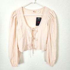 Nwt! Long Sleeve, Tie Front Top In Blush Pink. Size Small. Measures Approx 18" Armpit To Armpit, 17.5" Long, 25" Sleeve Length. 2 Fitted Levi's Blouse For Spring, Levi's Fitted Blouse For Spring, Trendy Levi's Spring Tops, Trendy Levi's Tops For Spring, Long Sleeve Tie Front Top, Pleated Sleeves, Tie Front Top, Boyfriend Shirt, Puff Sleeve Blouse