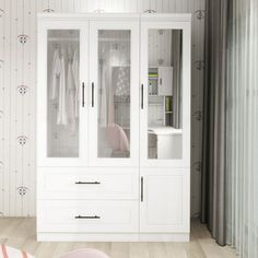 a white closet with glass doors and drawers in a room that has striped wallpaper on the walls