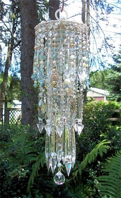 a crystal chandelier hanging from a tree