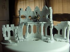 a castle made out of white clay on a table