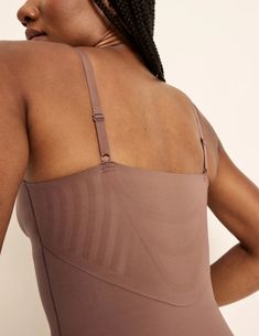 You asked, we delivered. Meet the new no-panty-line shapewear with a customizable back plunge. Smoothes and shapes flawlessly and comfortably. It’s designed to keep everything supported and even has a fully integrated, built-in bra (sizes go all the way up to a G cup). So you’re supported even when you make your PerfectCut™ to deepen your back plunge and go backless. Just cut along the velvet lines. Your perfect base layer for tight fits, low backs and no panty lines. | Knix Customizable Shaper Thong Bodysuit in Sola Orange Solid Bodysuit With Built-in Bra And Low Back, Stretch Low-back Bra-friendly Bodysuit, V-neck Stretch Smoothing Bodysuit, Solid Color Bodysuit With Built-in Bra And Micro-elastic Fit, Seamless V-neck Shapewear Intimate, G Cup, Wireless Bras, Wireless Bra, The Velvet