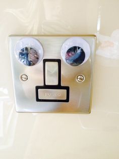 a close up of a metal switch with two buttons