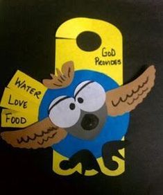 an owl holding a sign that says water love food