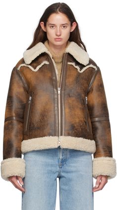 Faux-leather jacket. Distressing and faux-shearling trim throughout. · Spread collar · Two-way zip closure · Raw edge at front and back yoke · Zip pockets · Locker loop at interior · Faux-shearling lining Supplier color: Brown/Natural Moda Country, Stand Studio, Aviator Jacket, Faux Shearling Jacket, Leather Outerwear, Trim Jacket, Aviator Jackets, Double Breasted Jacket, Woman Standing