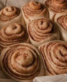 there are many cinnamon rolls in the basket