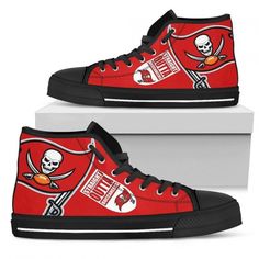 the tampa football team is depicted on red high top shoes with black laces and skulls