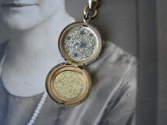 "A 1930's antique gold filled etched locket and floral bow brooch. The locket is etched with beautiful flowers and the initials \"JG\". It measures 7/8'' in diameter. The floral bow brooch measures 2 1/4'' x over 1 1/2''. It can be worn separate from the locket. The entire piece measures over 3'' x 2 1/4''. In good condition with some signs of wear to the gold on the brooch. May just need a real good polish." Antique Medallion Brooch For Wedding, Vintage Medallion Brooch For Wedding, Vintage Medallion Brooches For Wedding, Antique Locket Brooch For Wedding, Wedding Locket, Art Deco Locket, Wedding Tokens, Locket Gold, Nottingham Lace