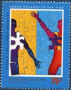 a postage stamp with two people holding hands and puzzles on the front, in blue and yellow