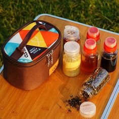 a picnic tray with condiments and bottles on it