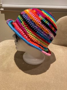 "Paint pour Colorful hand crocheted bucket hat Crown: 6.75\" Height: 8.5\" Width: 11.5\" Head circumference: 21-23\" Material: acrylic" Crocheted Bucket Hat, Suit Hat, Crochet Bucket, Crochet Bucket Hat, Bucket Hats, Head Circumference, Hand Crochet, Caps Hats, Bucket Hat