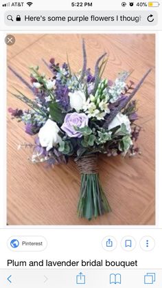 a bouquet of flowers sitting on top of a wooden table next to an instagram page