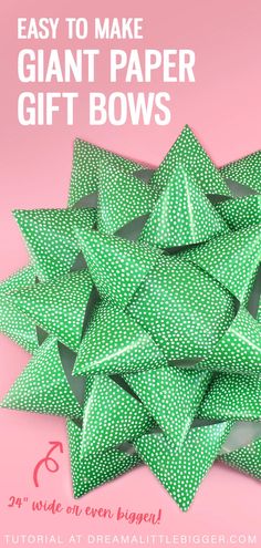 a pile of green paper bows with the words easy to make giant paper gift bows