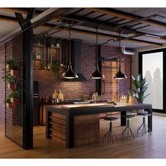 an industrial kitchen with brick walls and wooden floors, potted plants on the counter