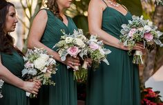 the bridesmaids are holding their bouquets together