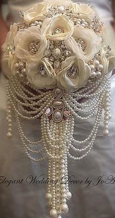 a bridal bouquet with pearls and flowers