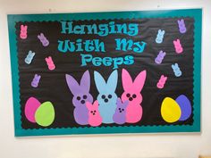 a bulletin board with bunnies, eggs and rabbits on it that says hamming with my pees