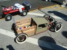 an old fashioned toy car is parked on the street