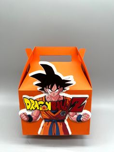 an orange box with the image of dragon ball z on it's front and side