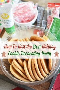 a bowl filled with cookies on top of a wooden table next to other food items