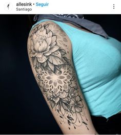 a woman with a flower tattoo on her arm