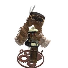 a doll is standing on top of a gear wheel