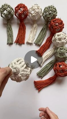 the video shows how to make an ornament out of yarn and cotton balls