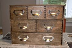 the drawers are made from wood and have metal handles