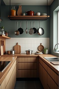 Organized small kitchen with overhead pot storage Overhead Kitchen Storage, Wall Pot Hanger Kitchen, Exposed Pots And Pans, Hang Pans On Wall, Hanging Pans Kitchen, Pots And Pans Storage Hanging, Pans Hanging In Kitchen, Hanging Storage Kitchen