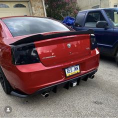 the rear end of a red sports car