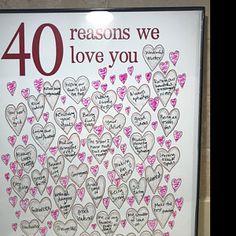 a sign that says, 40 reasons we love you with hearts and words on it