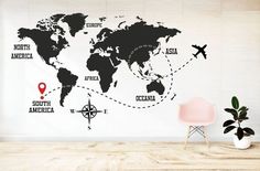 a wall with a world map on it and pins pointing in different directions to destinations