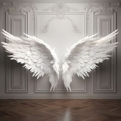 two white wings on a wall in an empty room with wood flooring and walls