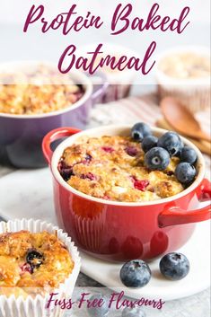 blueberry baked oatmeal in a red casserole dish with muffins