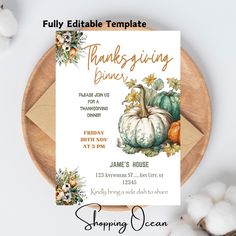 a thanksgiving dinner menu with pumpkins and cotton balls on the table next to it