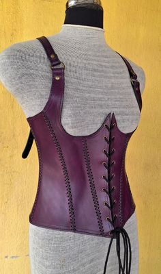 It is handmade leather Under-bust corset with hand-sewn leather detailing. It's adjustable Lace in front side and back side with buckles. We used about 2 to 2.2 mm thick handmade leather. It is hand dyed handmade leather. It is crazy for medieval events and Larp.   Corset is hand made from sturdy top-grain leather.  Bust Size is available  28 Inch to 46 inch DETAILS: ► 100% Handmade ► 100% Genuine leather ► Made on your measurements ► Unique design ► LARP standard ► Worldwide delivery Usually it Steampunk Leather Corset Belt For Cosplay, Brown Leather Steampunk Corset Belt, Steampunk Leather Corset Belt For Festivals, Leather Steampunk Corset Belt For Festivals, Gothic Leather Corset Belt For Larp, Fitted Leather Overbust Corset, Fitted Leather Underbust Corset, Fitted Underbust Leather Corset, Steampunk Leather Corset For Cosplay