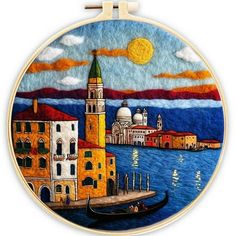 a painting on a wall hanging in front of a mirror with an image of venice