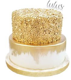 a cake with gold sprinkles on it