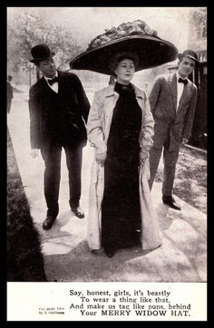 an old black and white photo shows three people standing on the sidewalk, one wearing a large hat