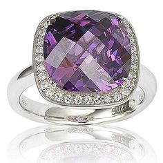 This ring features a cushion-cut purple cubic zirconia center stone with round-cut white cubic zirconia around it, hand set in sterling silver. A special Suzy Levian signature secret stone inside and a unique Suzy Levian designer gallery complete this piece. Ruby Engagement Ring Set, White Gold Ruby Ring, Levian Jewelry, Gemstone Brooch, Unique Engagement Ring Settings, Cubic Zirconia Bracelet, Ruby Engagement Ring, Cubic Zirconia Jewelry, Amazon Store