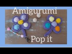 two crocheted flowers with the words amigurumii pop it