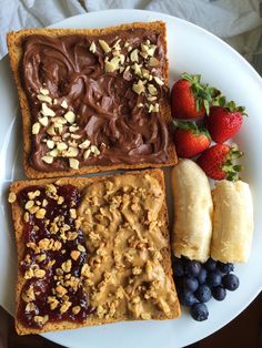 a white plate topped with fruit and peanut butter