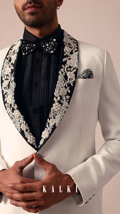 Dazzle on your special day with our Opulent White Jacquard Tuxedo.
It showcases intricate embroidery on the blazer with CutDana Githa and Embellished work.
This set includes one blazer waistcoat shirt bottom and bowtie.
This tuxedo is a standout choice for a memorable and stylish celebration. Blazer Waistcoat, Lapel Design, Tuxedo For Men, Men's Suit, Intricate Embroidery, Wedding Outfits, Embroidery Fashion, Your Special, Wedding Outfit