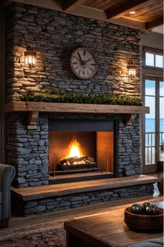 a stone fireplace with a clock above it