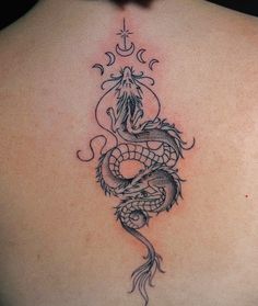 a woman with a dragon tattoo on her back