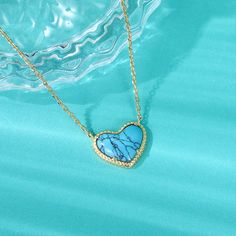 Lending a cool vibe to your look, this necklace makes a fitting choice for everyday wear. We love the textured heart shaped blue stone which gives it a touch of premium appeal while maintaining its elegance. It is suspended from a yellow gold tone sterling silver chain. Whether chosen as a gift or just for you, the details of this necklace were designed to be adored. Pair the heart-cut turquoise necklace with your favorite delicate pieces for a lovable layered look.Carat Weight: 2.1 ctStone Size Necklace Online, Chrome Nails, Blue Heart, Sterling Silver Necklace, Turquoise Sterling Silver, Blue Stone, Earring Necklace, Watch Design, Quality Jewelry