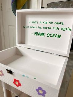 an open box with writing on it sitting on top of a table in a room