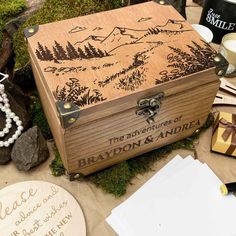 an open wooden box sitting on top of a table next to other items and decorations