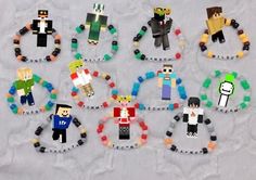 several different types of toy figures made out of legos on a sheet of paper